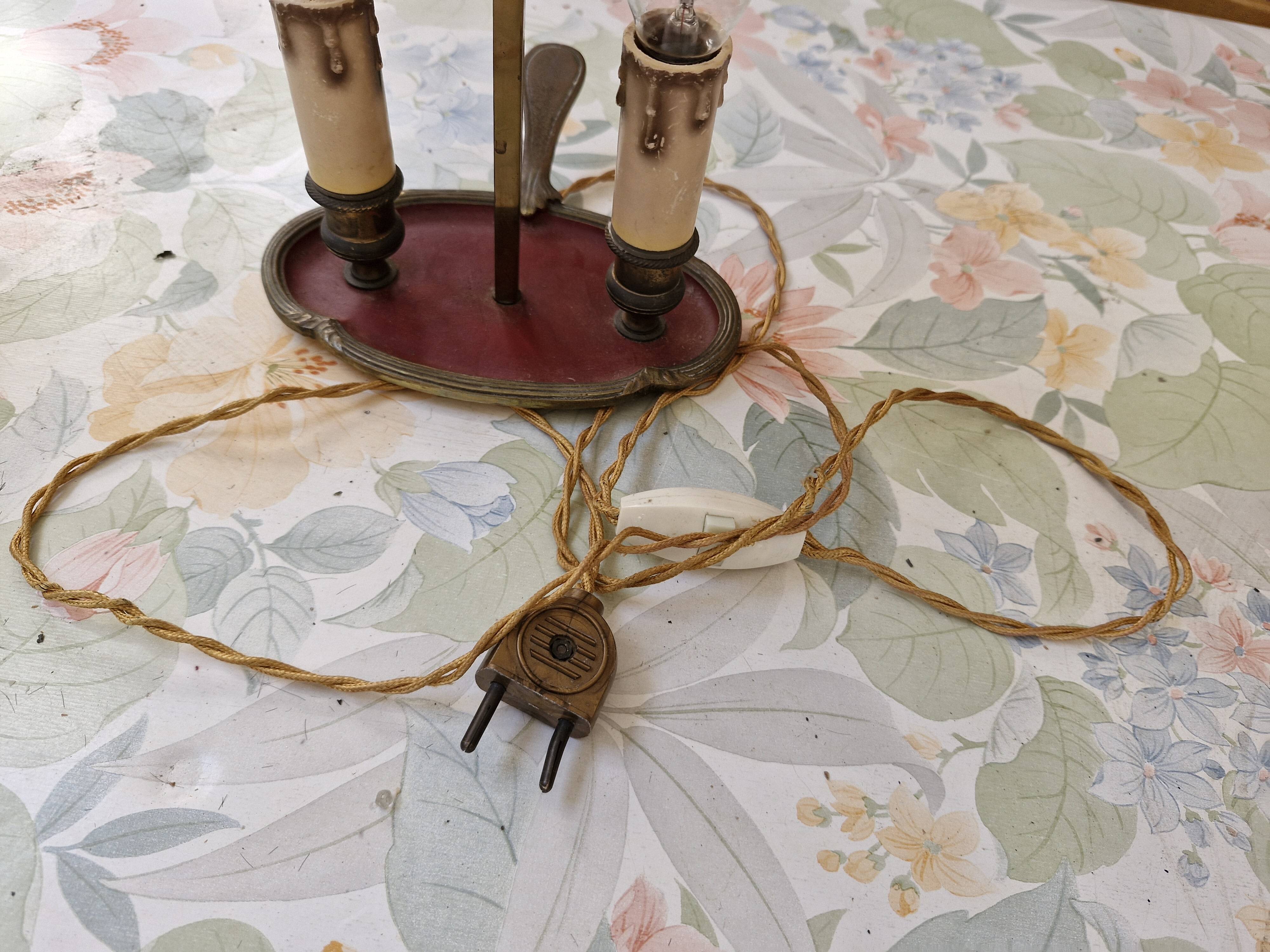 Old silver-plated bronze lamp, except for the arms which are not silver.