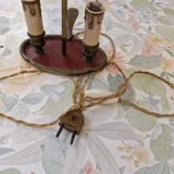 Old silver-plated bronze lamp, except for the arms which are not silver.