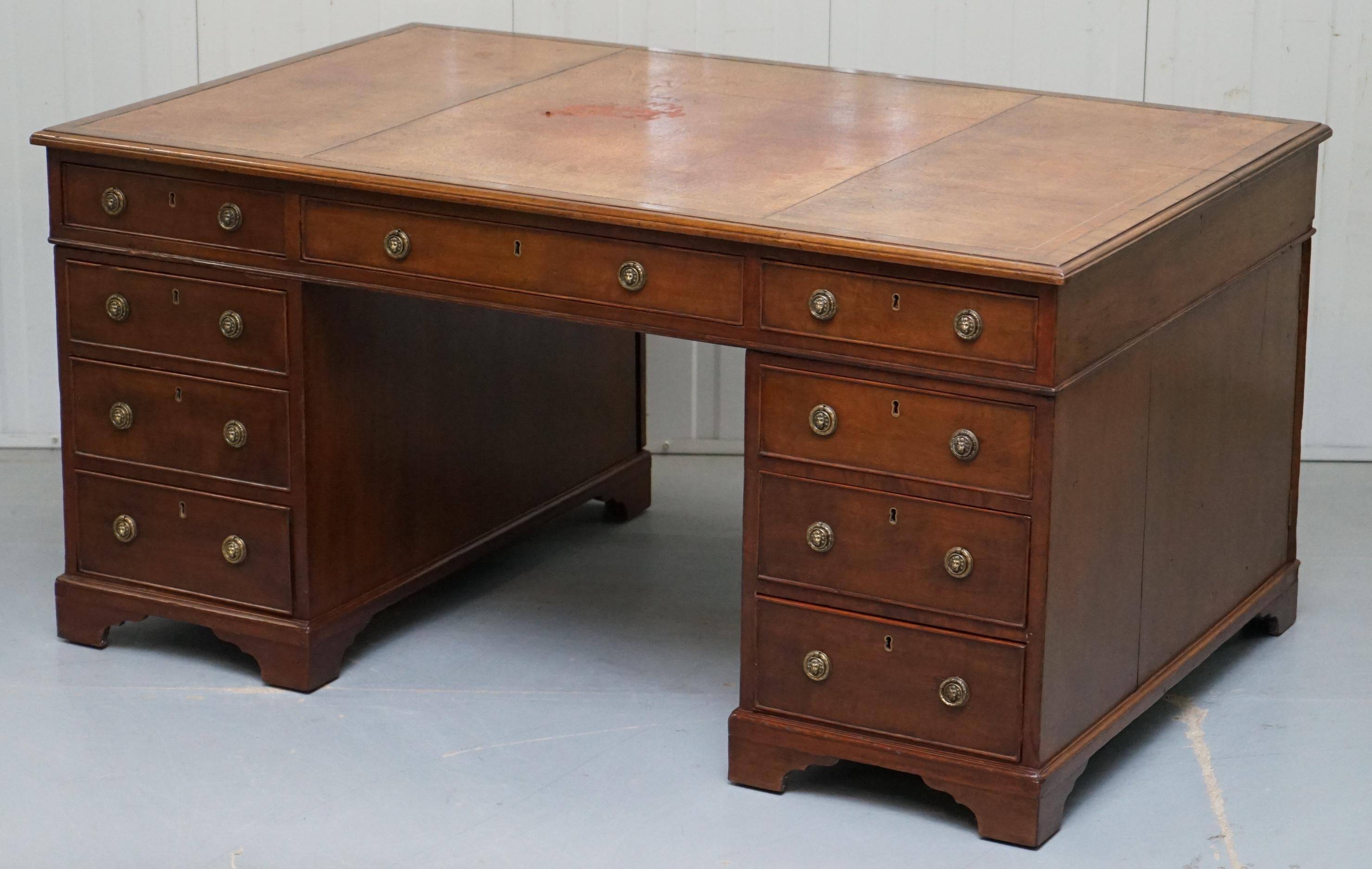 Double-sided partner's desk in walnut, George III, circa 1780, with lion head handles.
