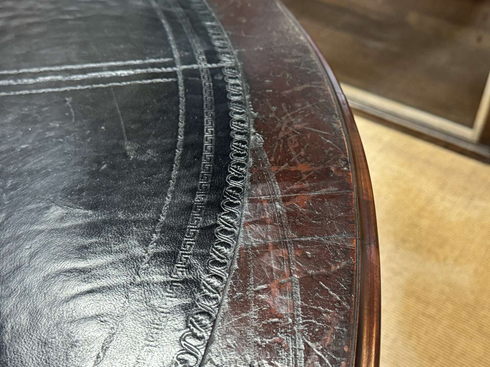 Large English library table in dark walnut with a leather top.