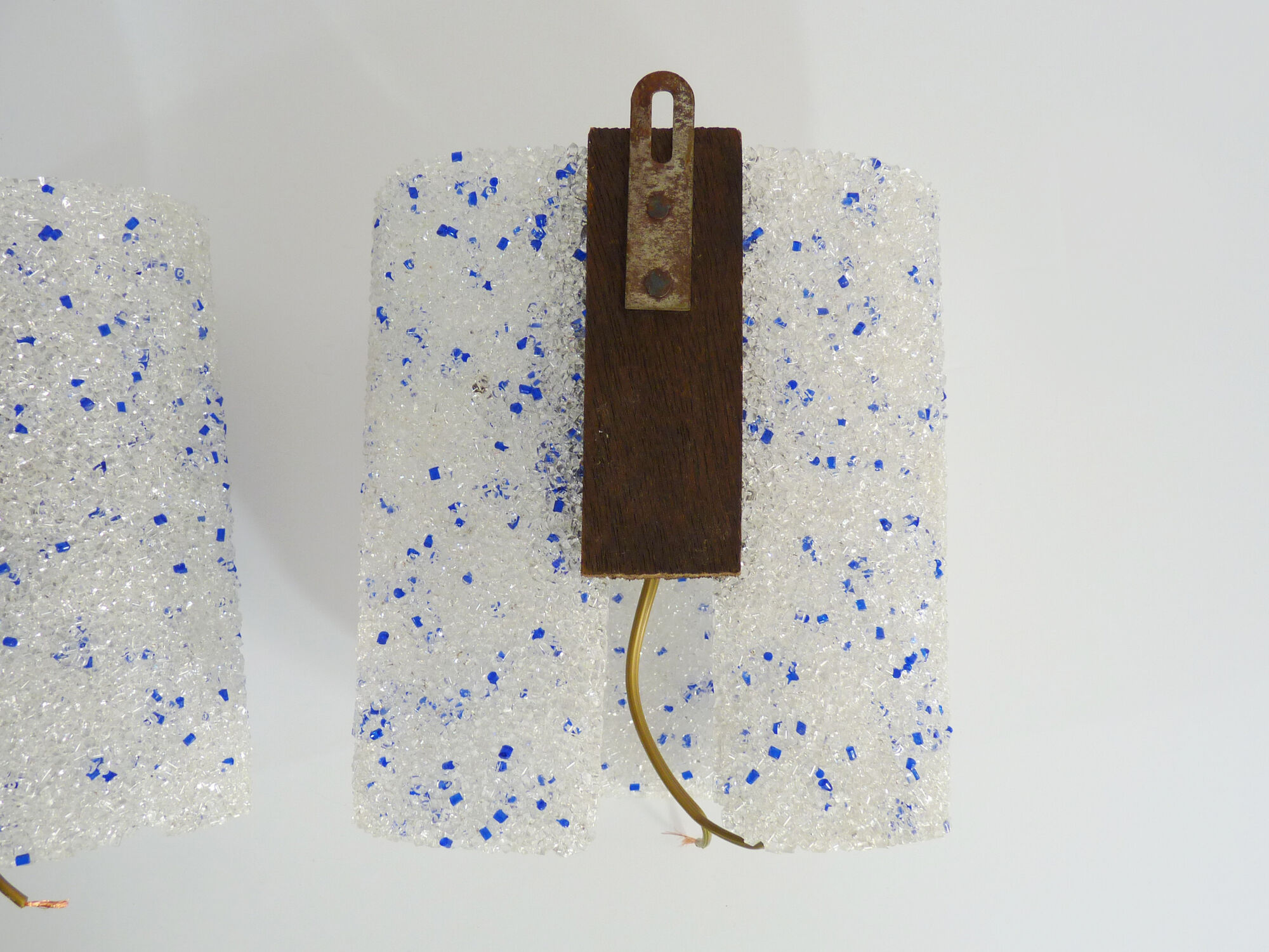 Pair of vintage wall sconces in transparent and wavy blue perspex. Year 60