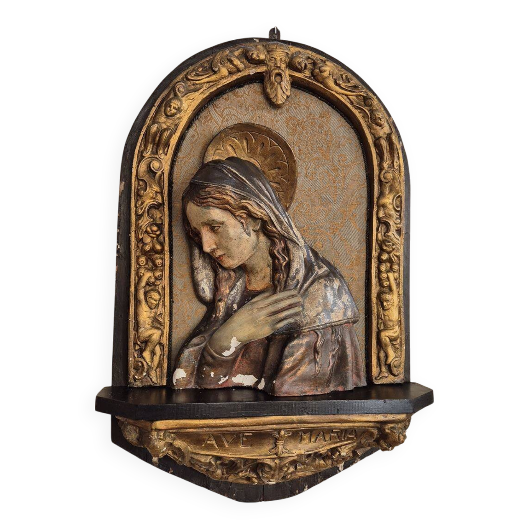 Ancient bas-relief in wood and stucco