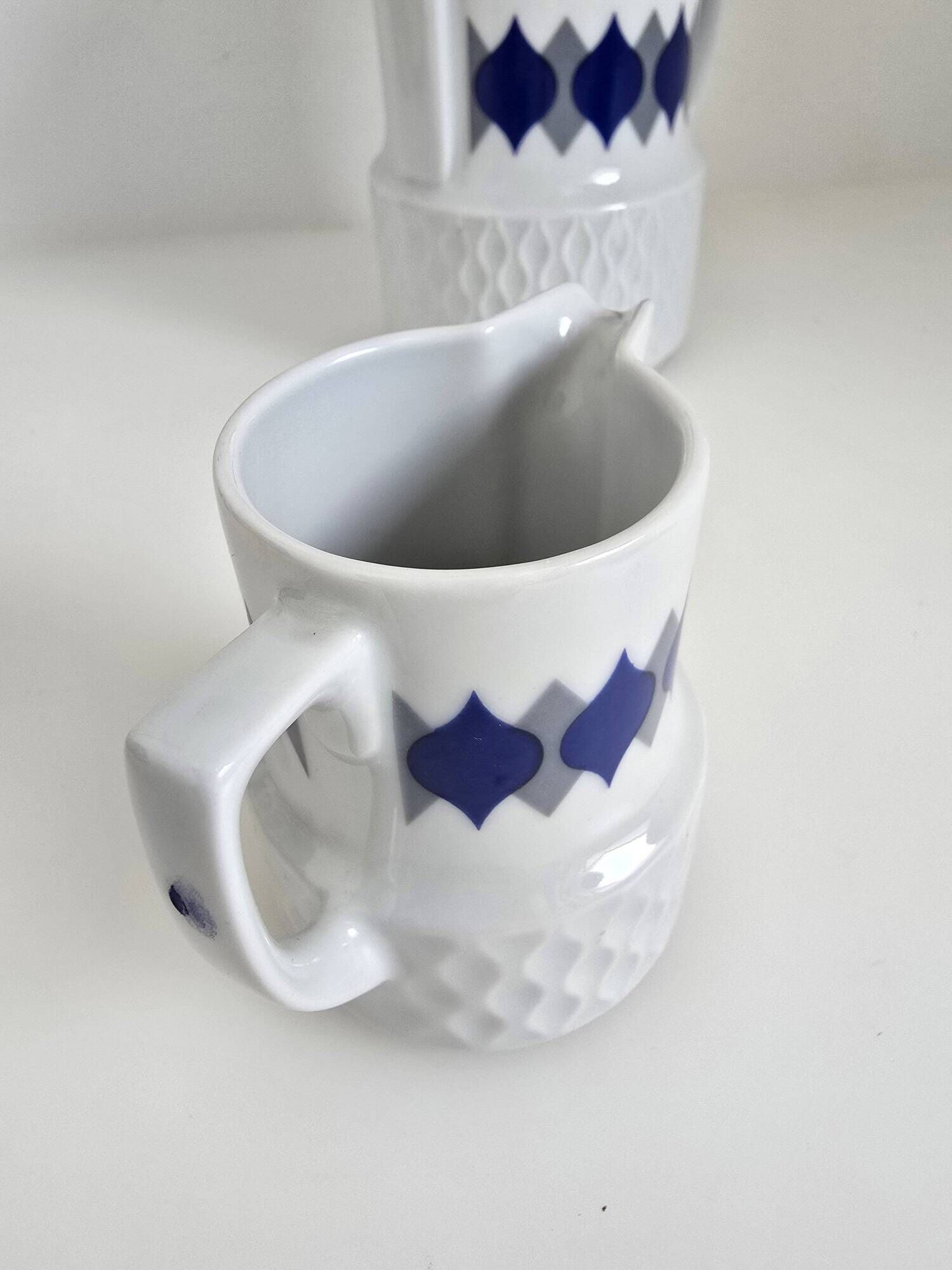 Vintage Schirnding Bavaria coffee pot and milk jug, blue geometric pattern.