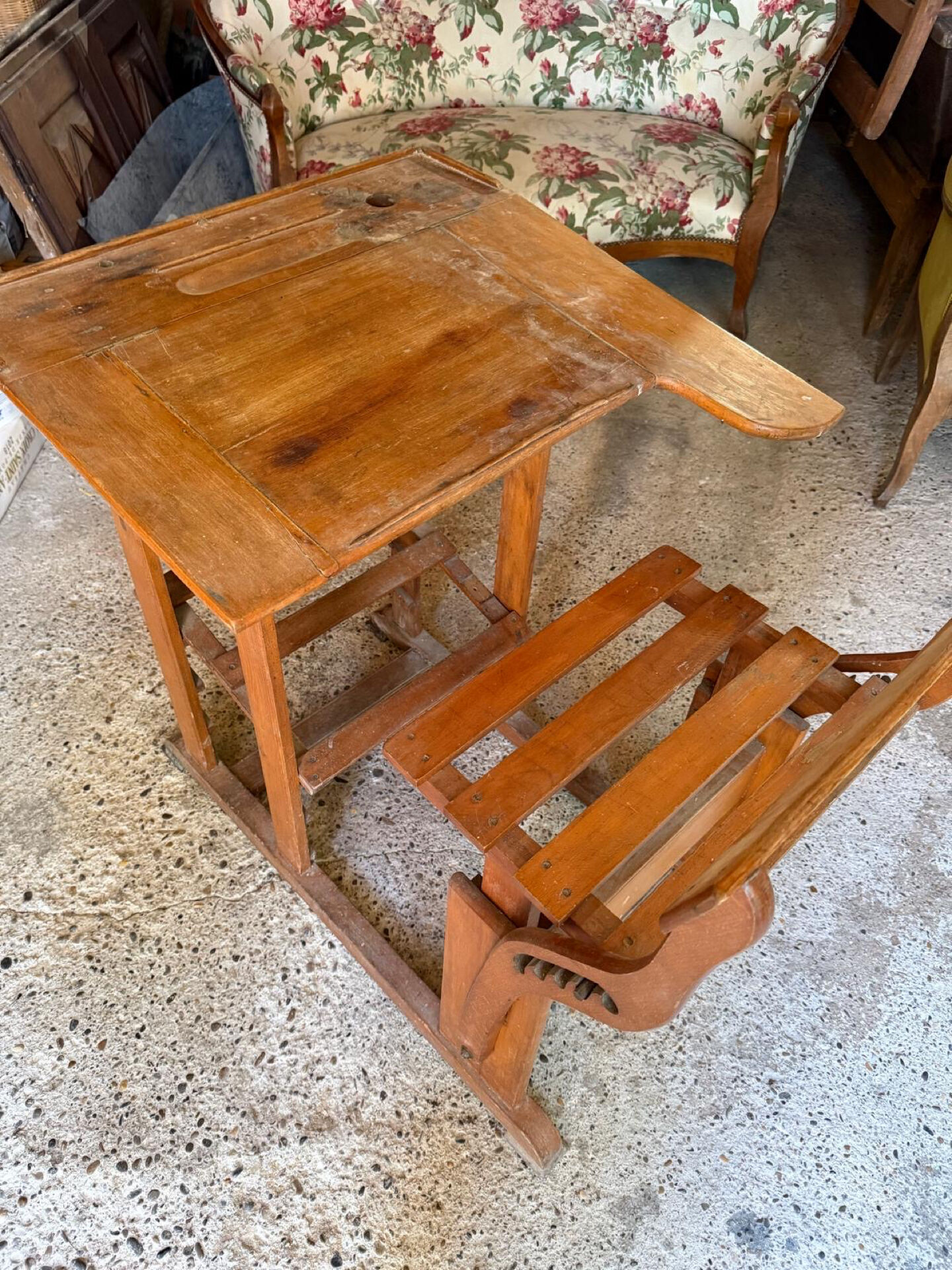 Old school desk with integrated adjustable seat.