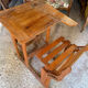 Old school desk with integrated adjustable seat.