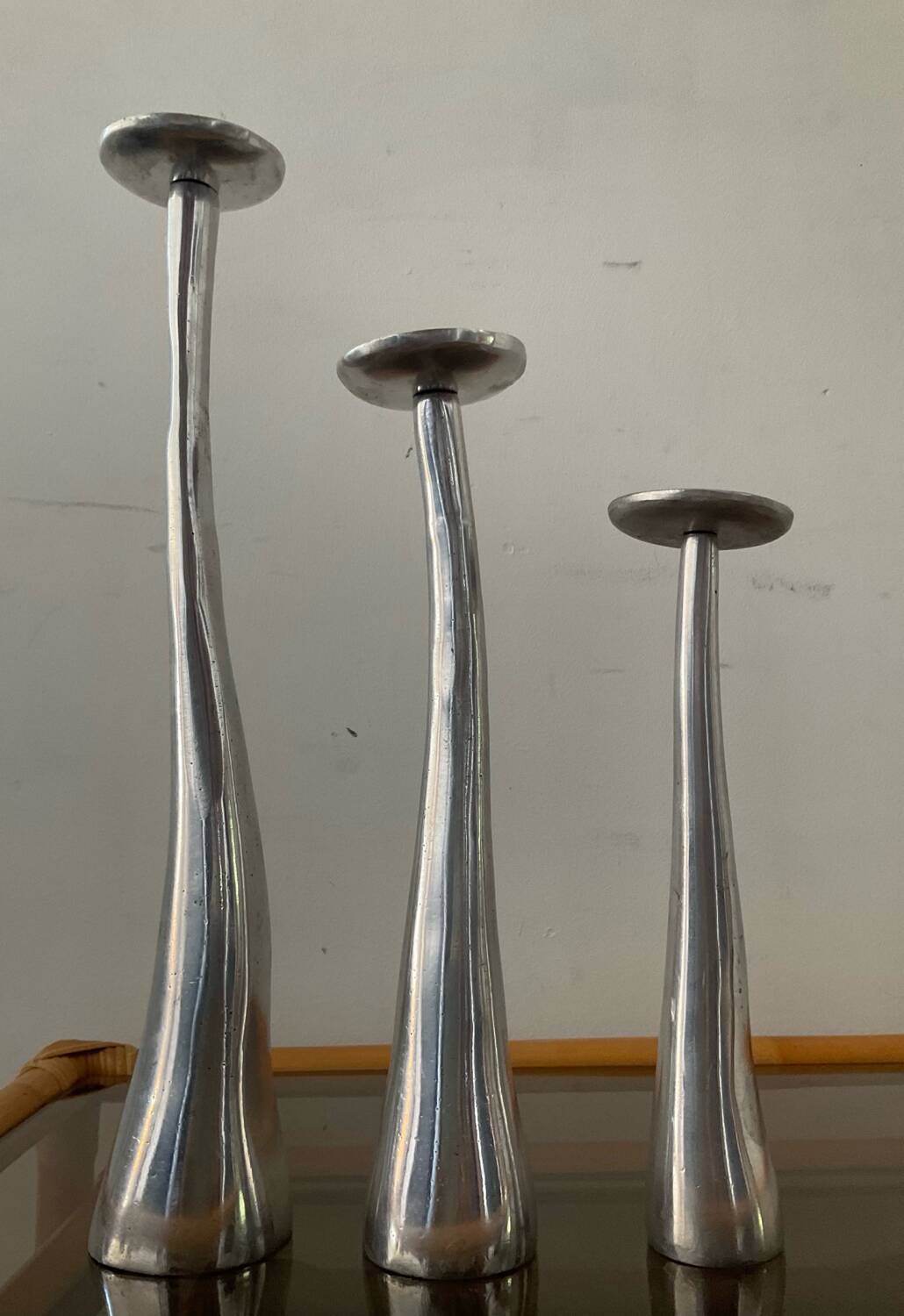 Trio of vintage cast aluminum candlesticks