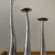 Trio of vintage cast aluminum candlesticks