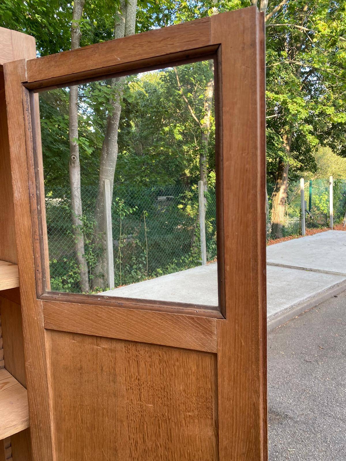 Parisian bonnetière cabinet, stripped display in solid oak from the 1930s.