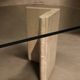 Dining table in travertine and smoked glass.