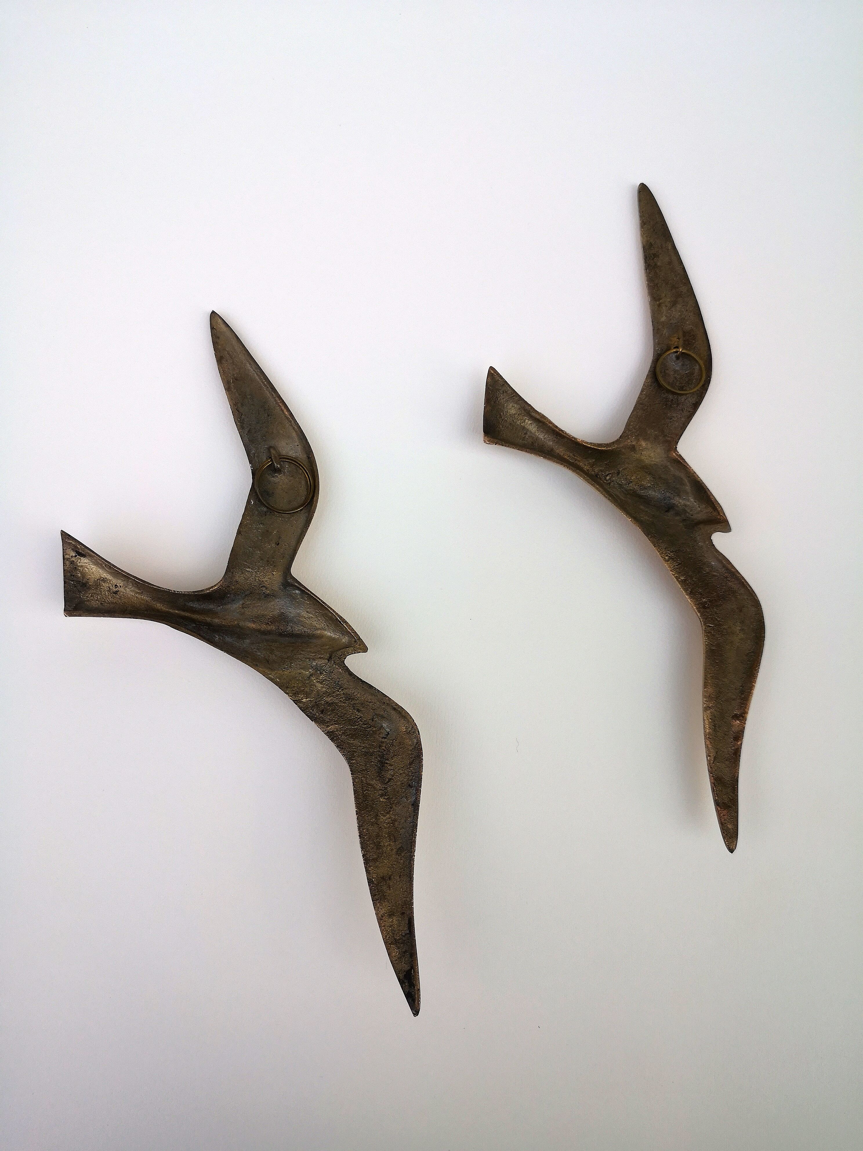 Stylized brass birds