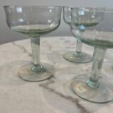 Set of four blown glass stemmed glasses.