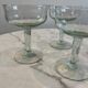 Set of four blown glass stemmed glasses.
