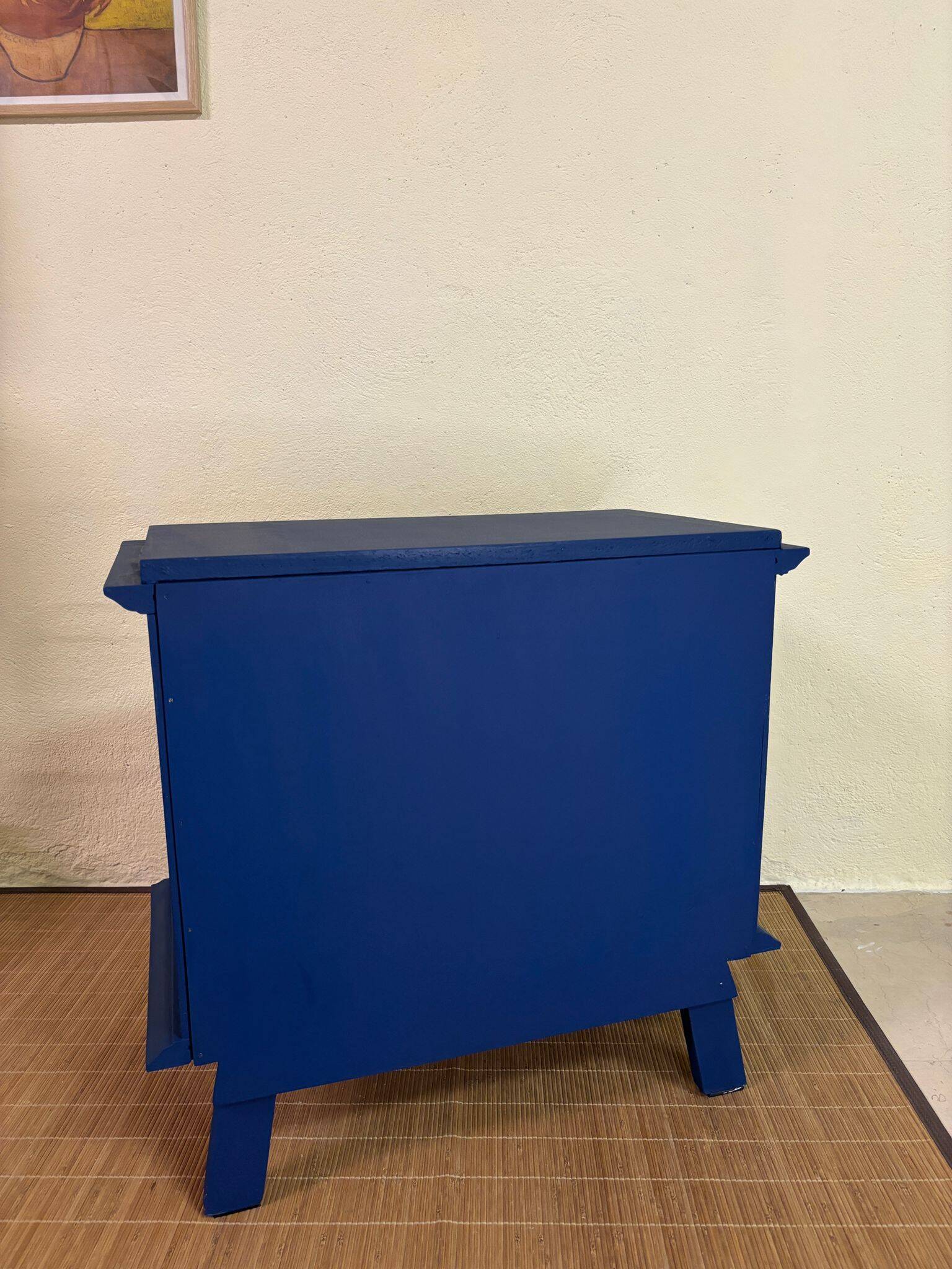 Small vintage upcycled side table in midnight blue and raw wood, with a rose-shaped door.