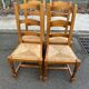 4 solid wood straw-seated chairs, oak, 20th century, 105cm