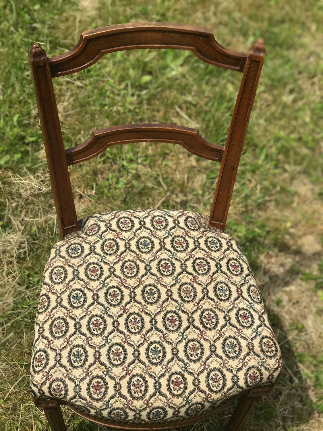 Antique chair seat upholsterer medallions