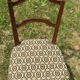 Antique chair seat upholsterer medallions