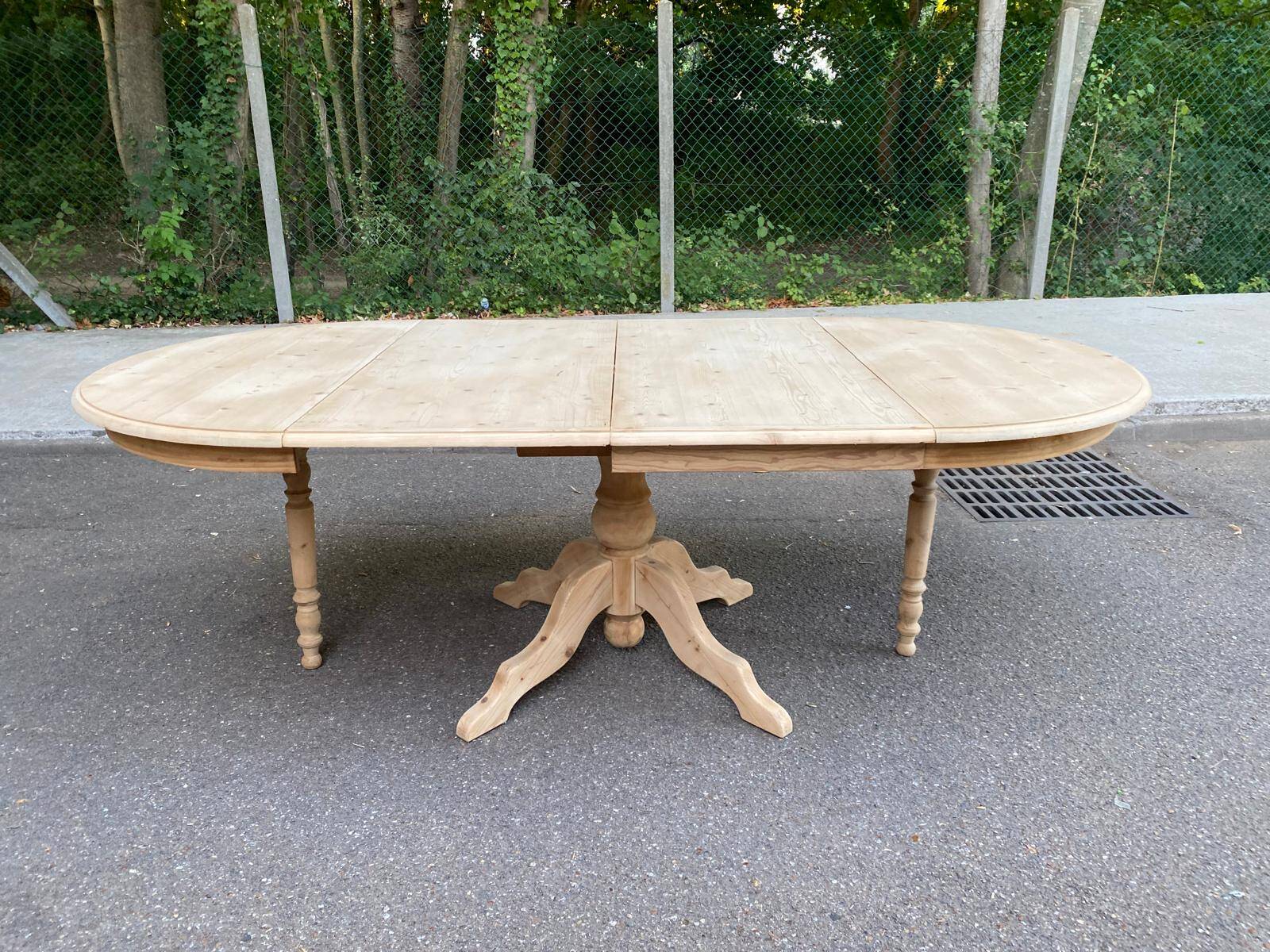 Large round extendable dining table renovated in raw pine with 2 extensions, 1980.