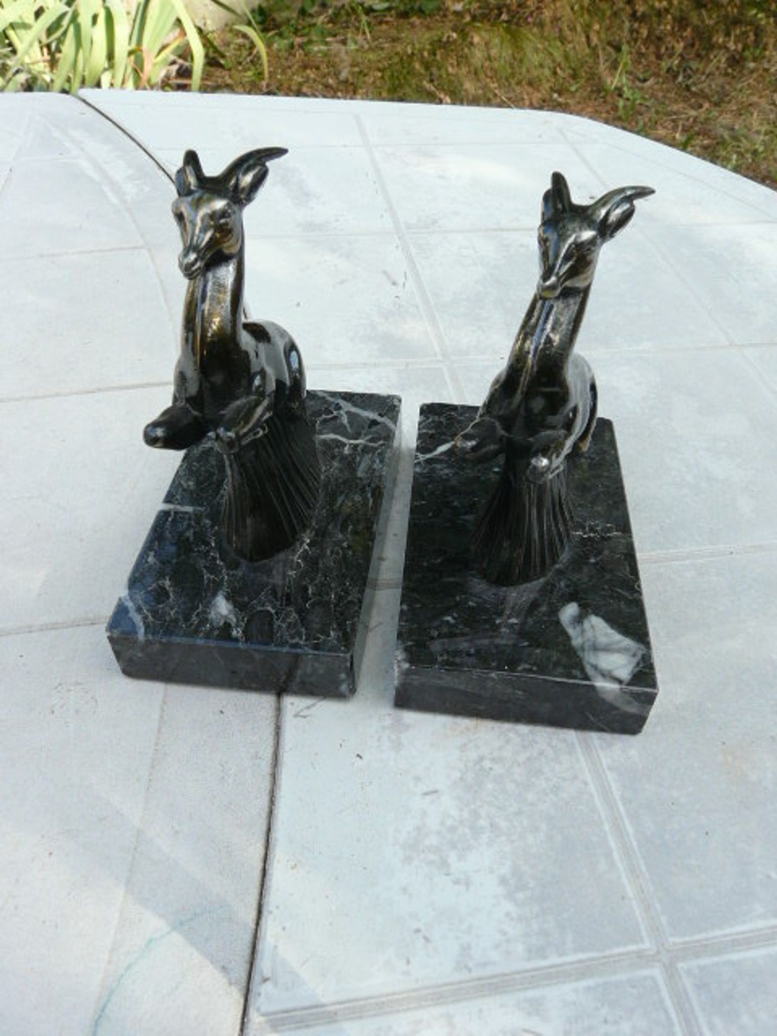 Pair of greenhouse book antelope in regulation on marble base