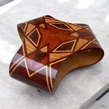 An Art Deco coffee table in multi-colored beech and rosewood.