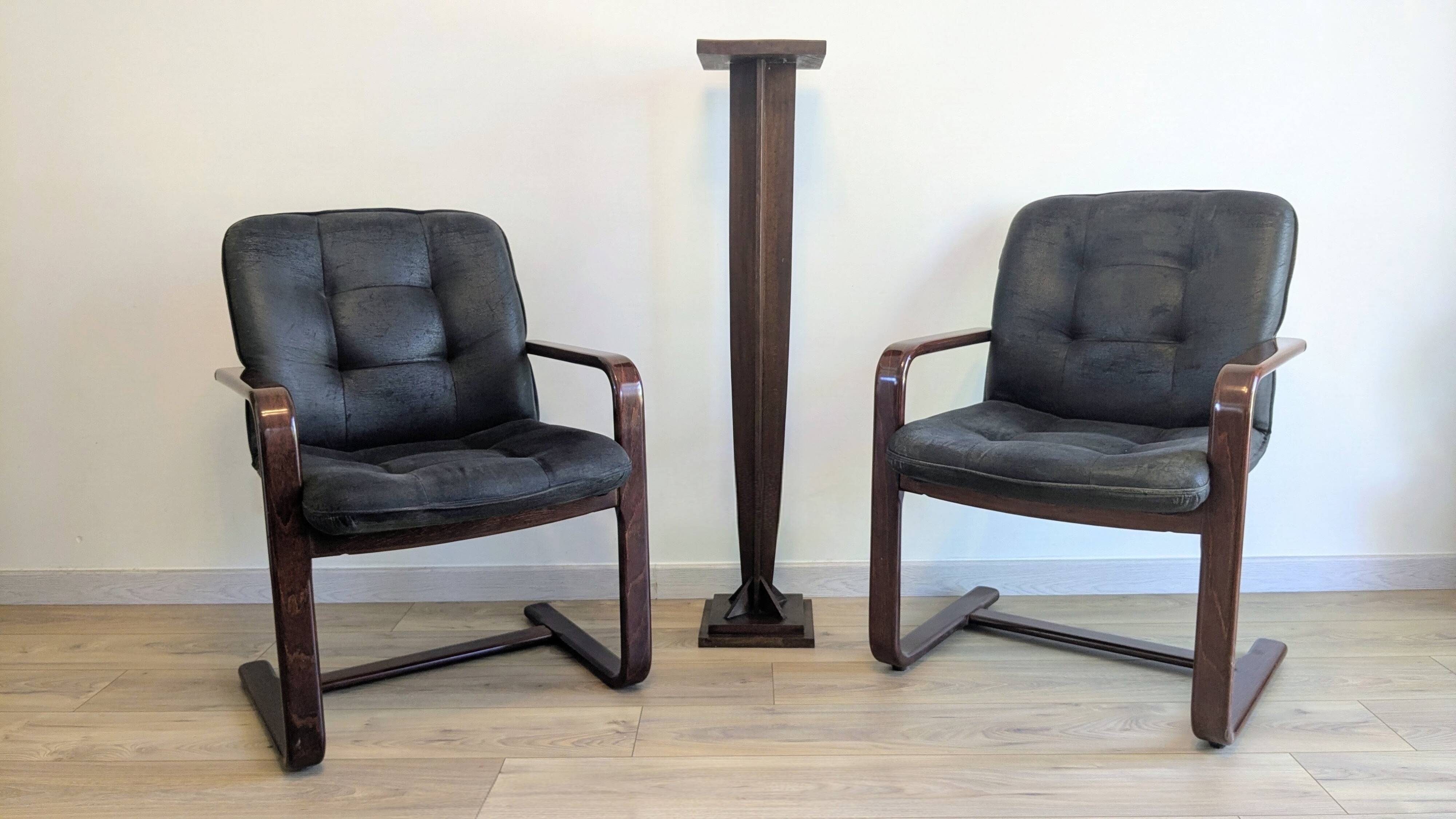 Pair of vintage cantilever armchairs in rosewood veneer.