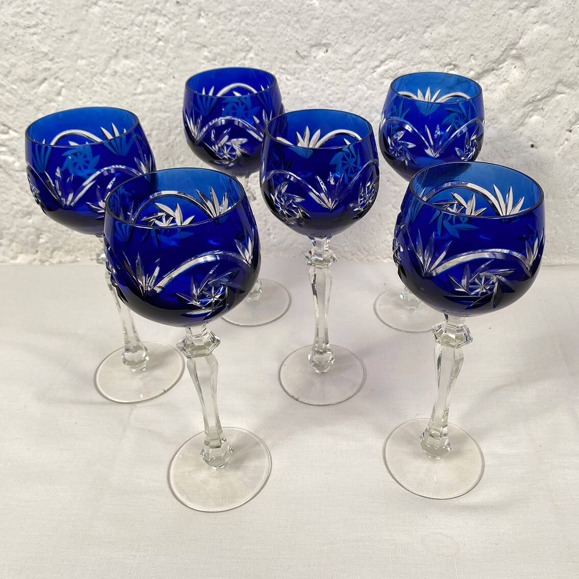 Bohemia. Series of six cut crystal wine glasses from the Rhine in blue.