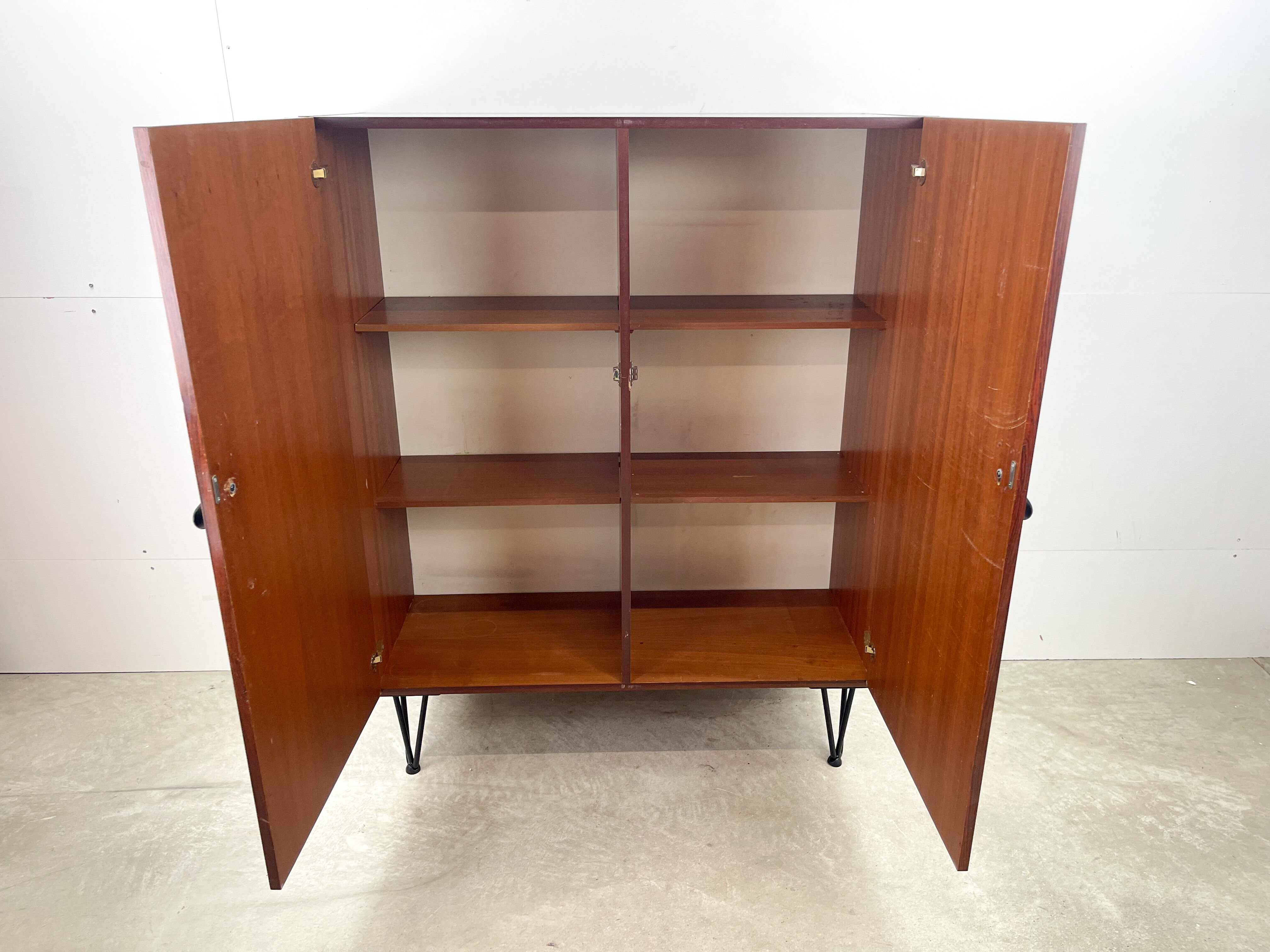 Rosewood cabinet with hairpin legs
