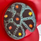 Dish in the form of a palette with a black background. From the 1960s.