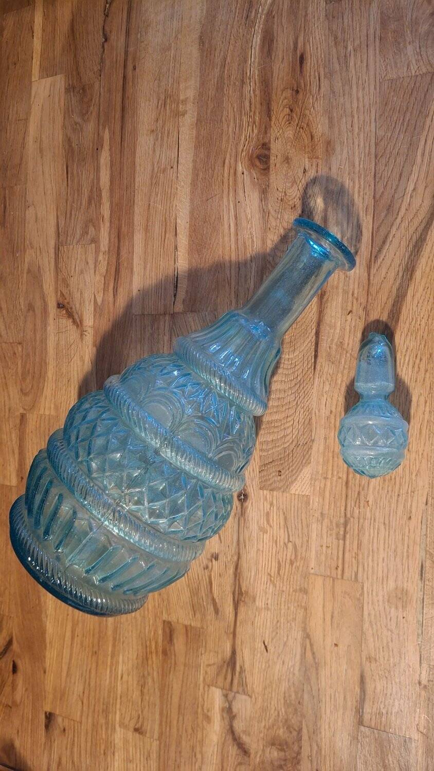 Pair of cut blown glass carafes in blue-green from the 19th century.
