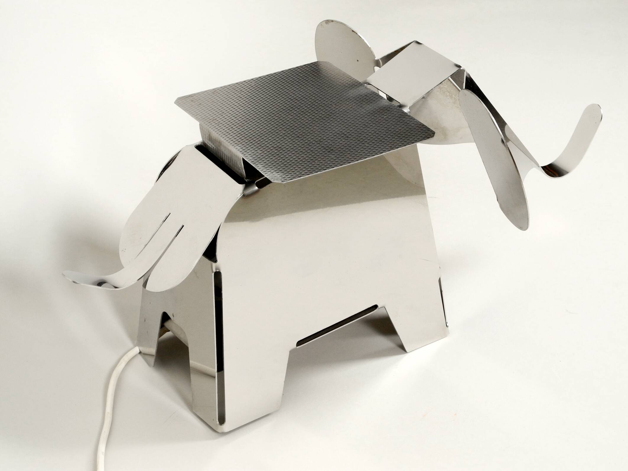 80s heavy metal chrome elephant floor lamp as side table Postmodern design