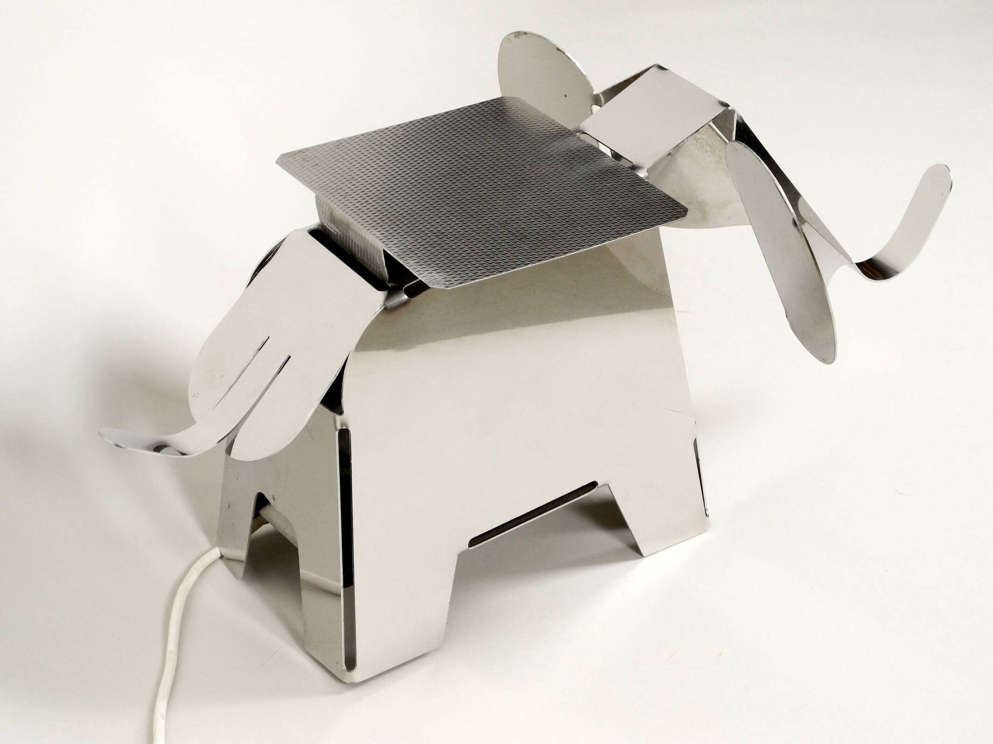 80s heavy metal chrome elephant floor lamp as side table Postmodern design