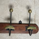 Wood and brass coat rack