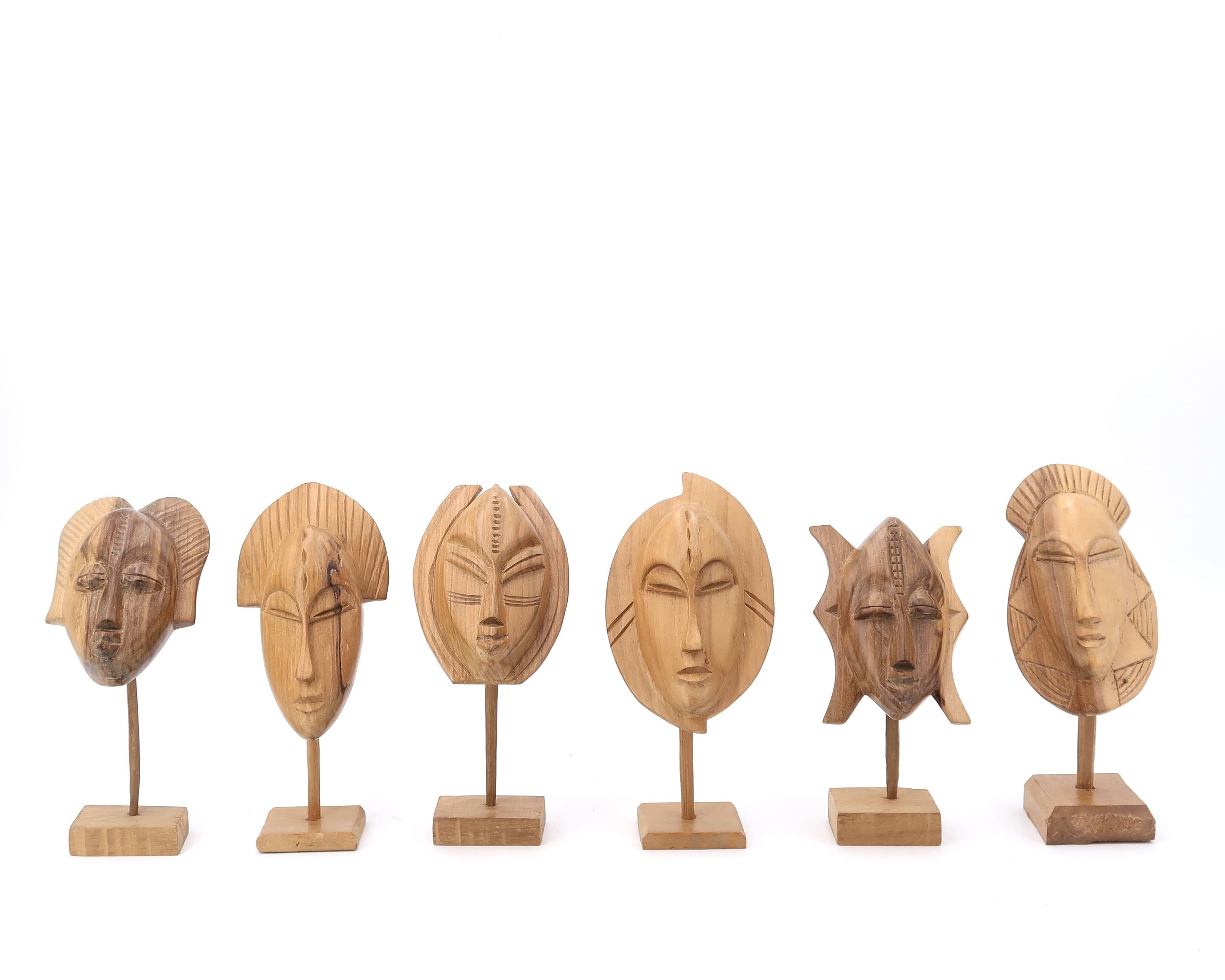 Six African masks with wooden bases, 1970s