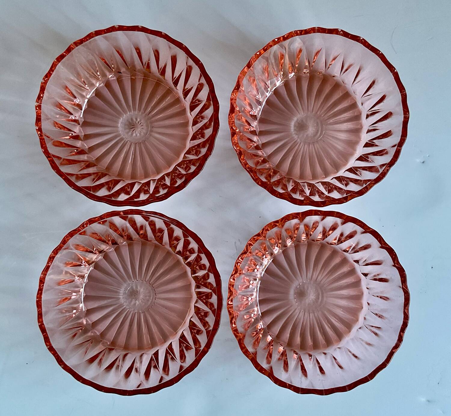 4 pink glass bowls