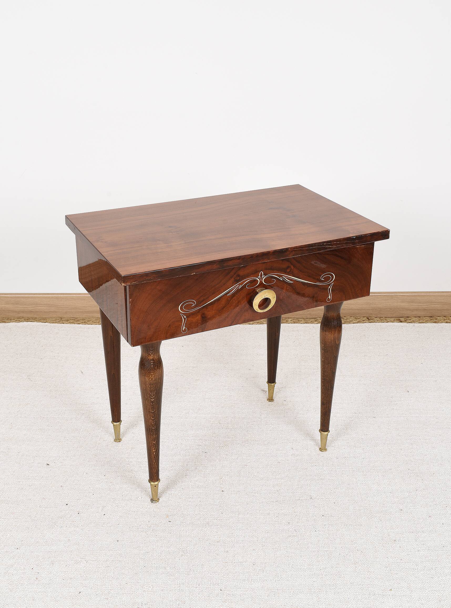 Vintage bedside table from the 70s in varnished wood.