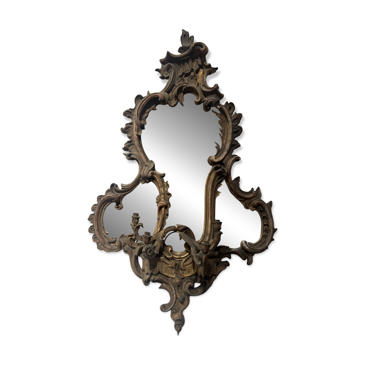 Mirror with a decorative frame featuring a four-light wall sconce, 19th century.