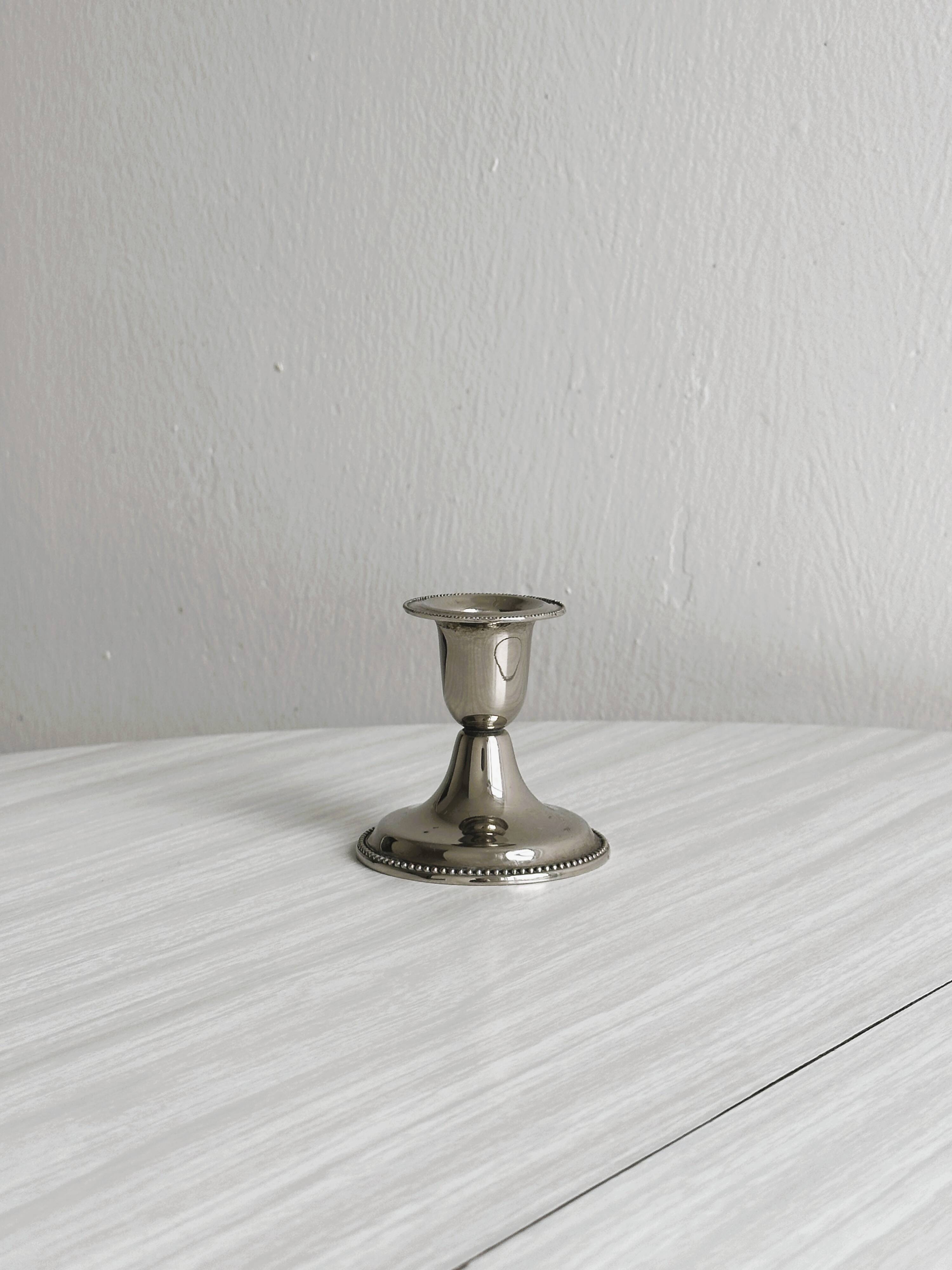 Small antique metal candle holder