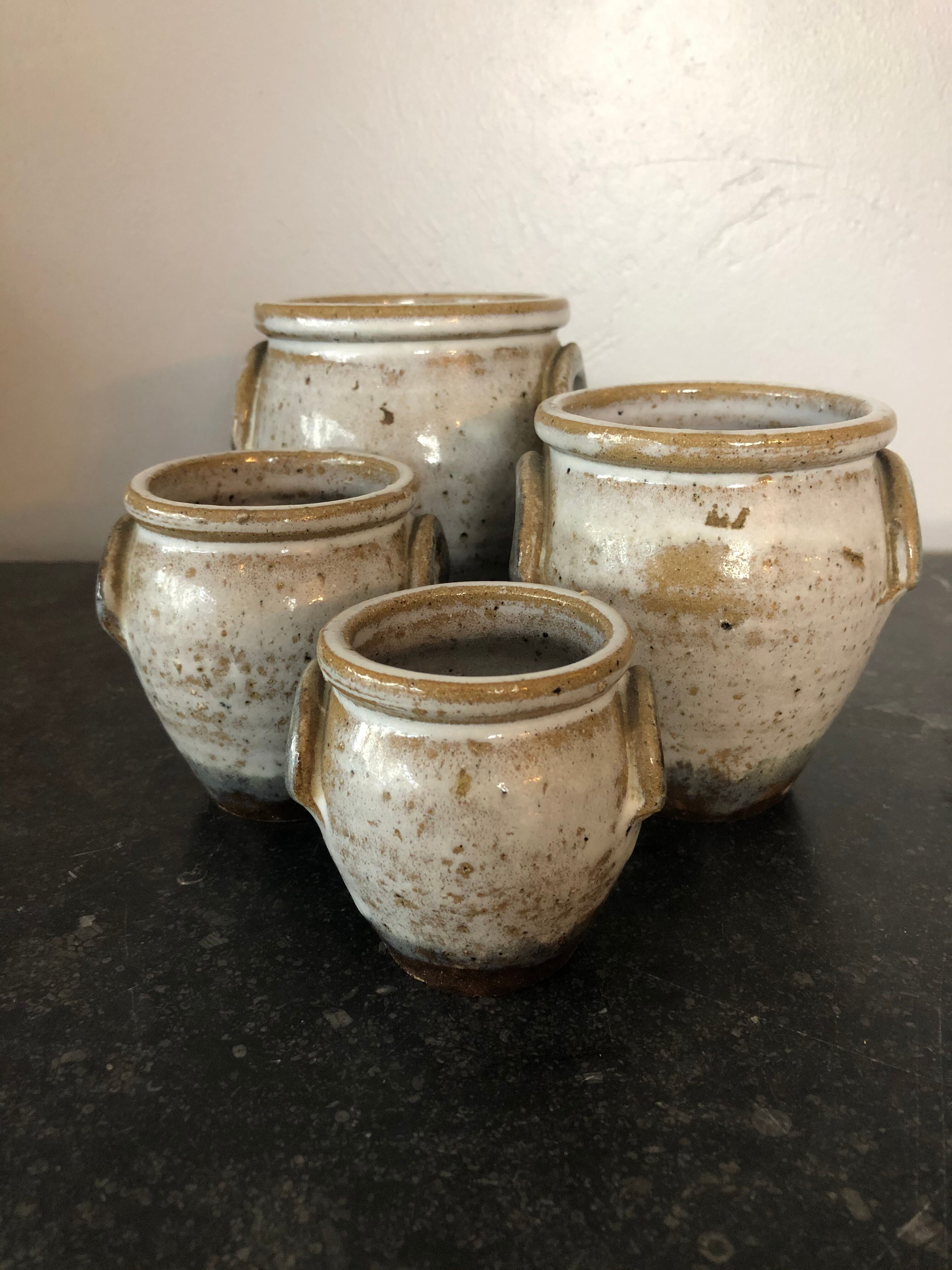 Set of 4 enamelled sandstone pots