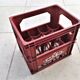 Locker with 12 red plastic bottles of the cfp brand around 1980