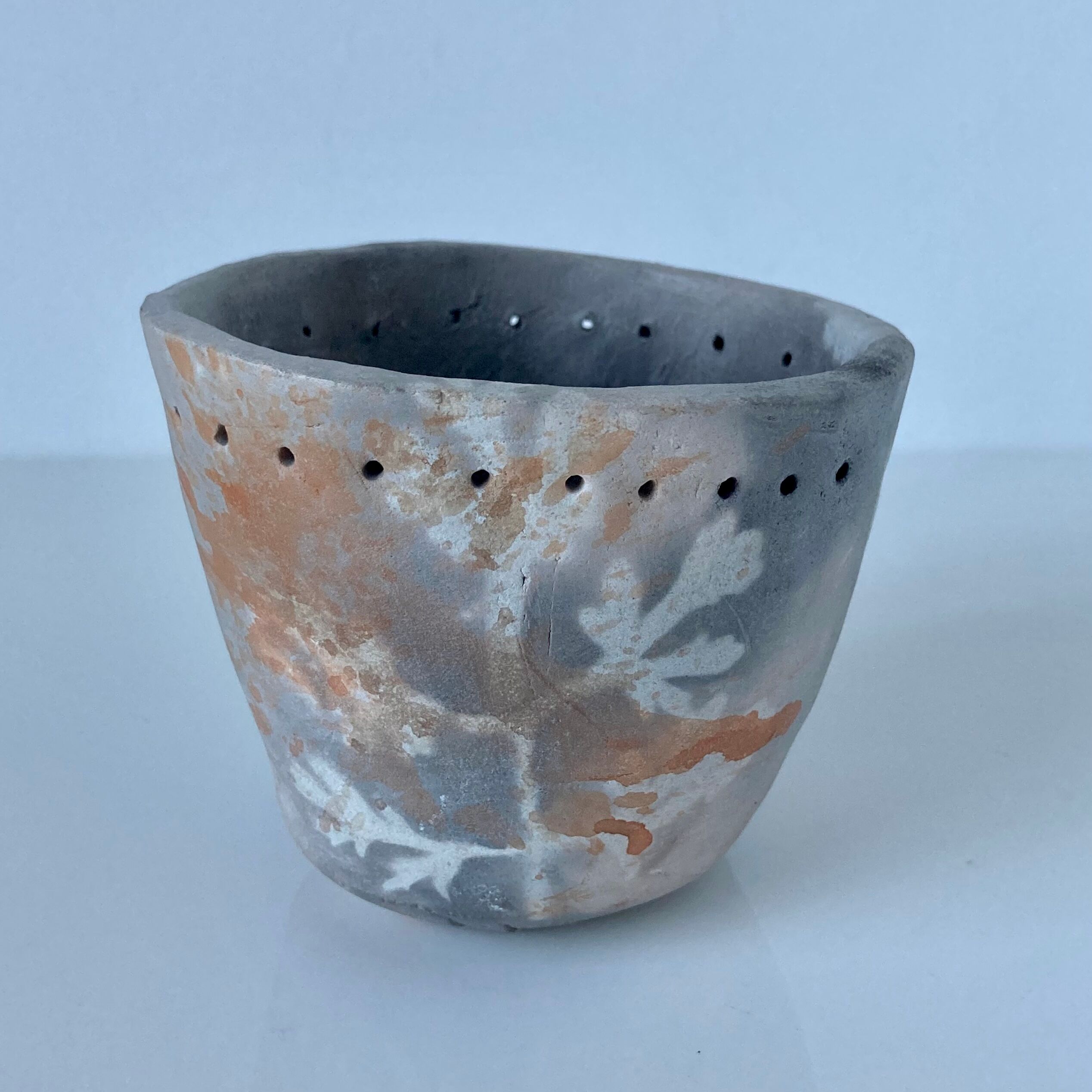 Signed ceramic pot with plant decoration