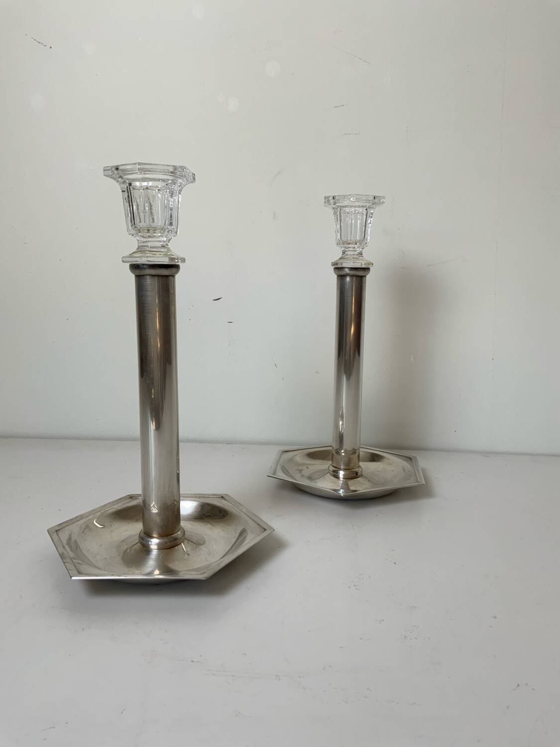 Pair of silver-plated metal candlesticks