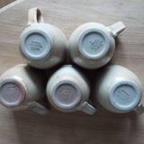 5 cups and saucers in marsh sandstone