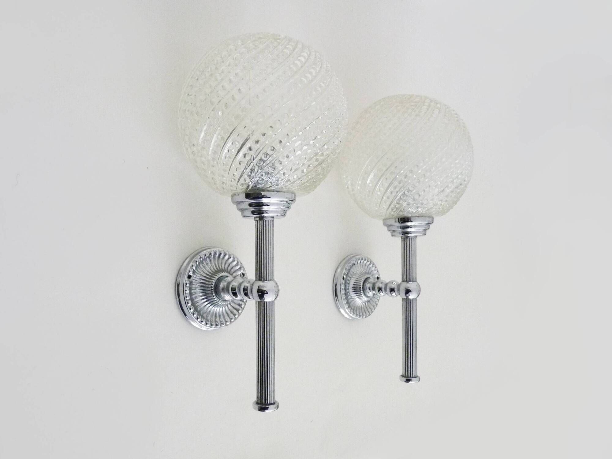 Pair of vintage Karl Lenz wall sconces. Chrome-plated metal and glass