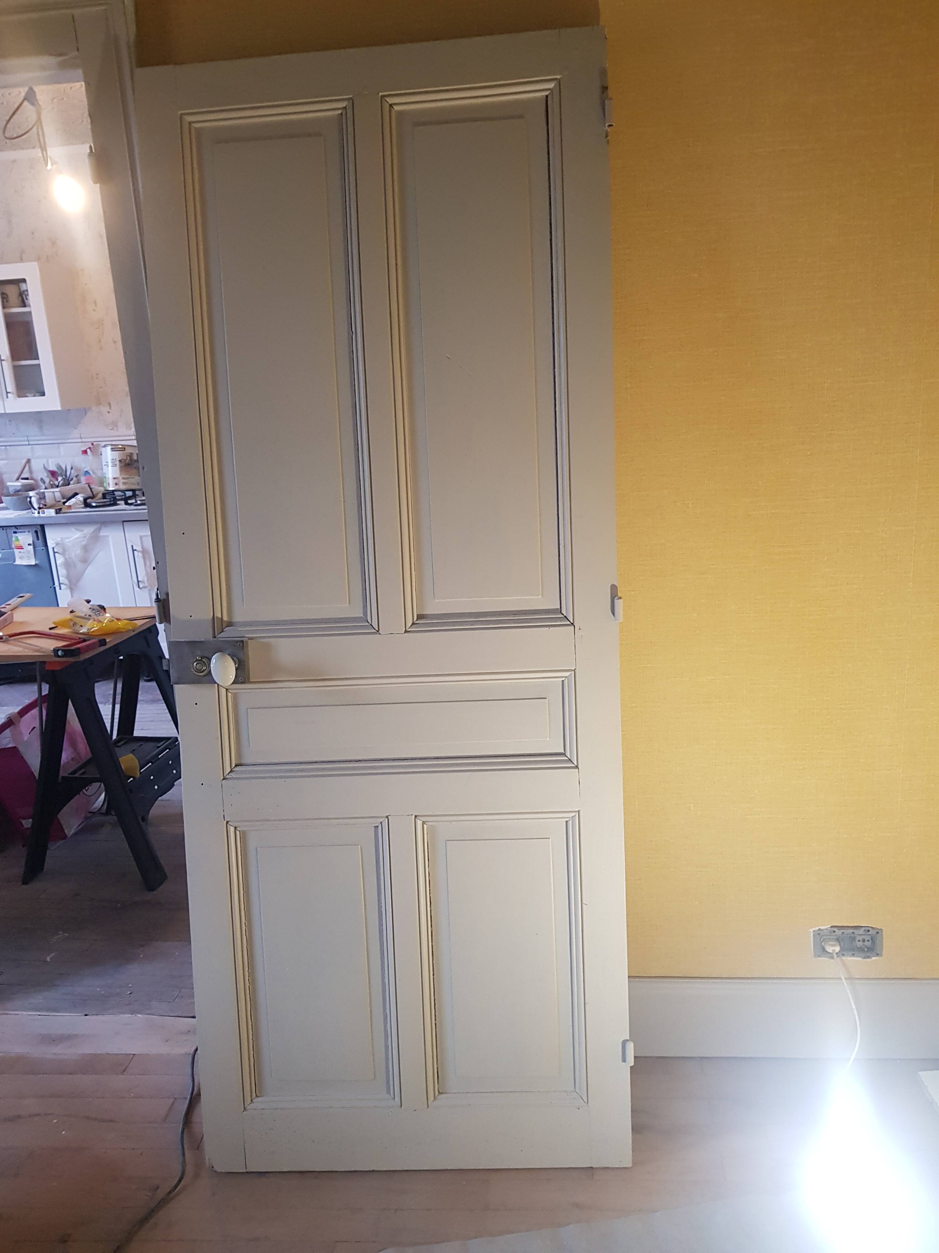 Large painted oak interior door with its hinges