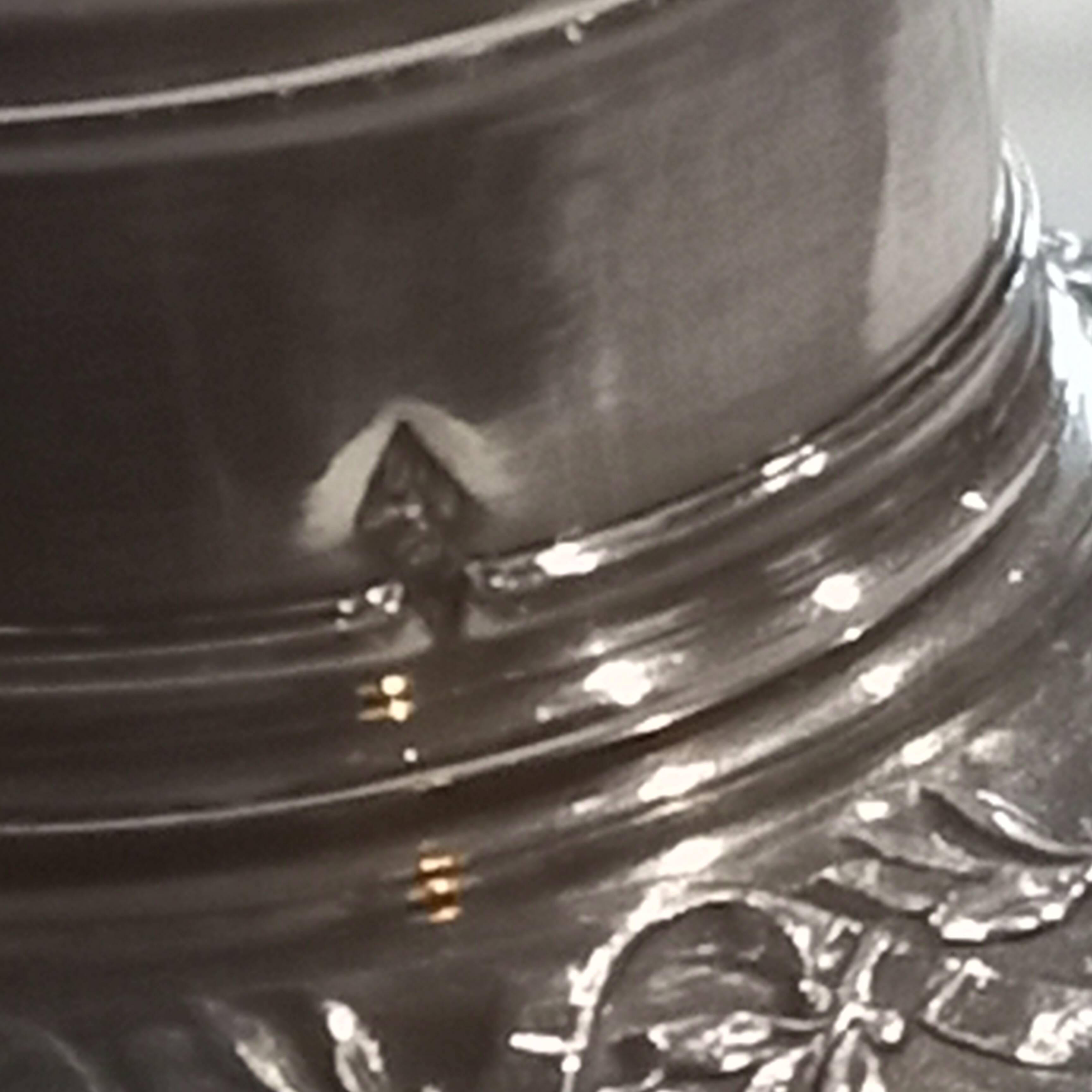 Crystal and solid silver shaker, neck brace and master's mark.