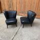 Pair of black cocktail chairs in beech and vinyl, Mid-Century style, 1950s.
