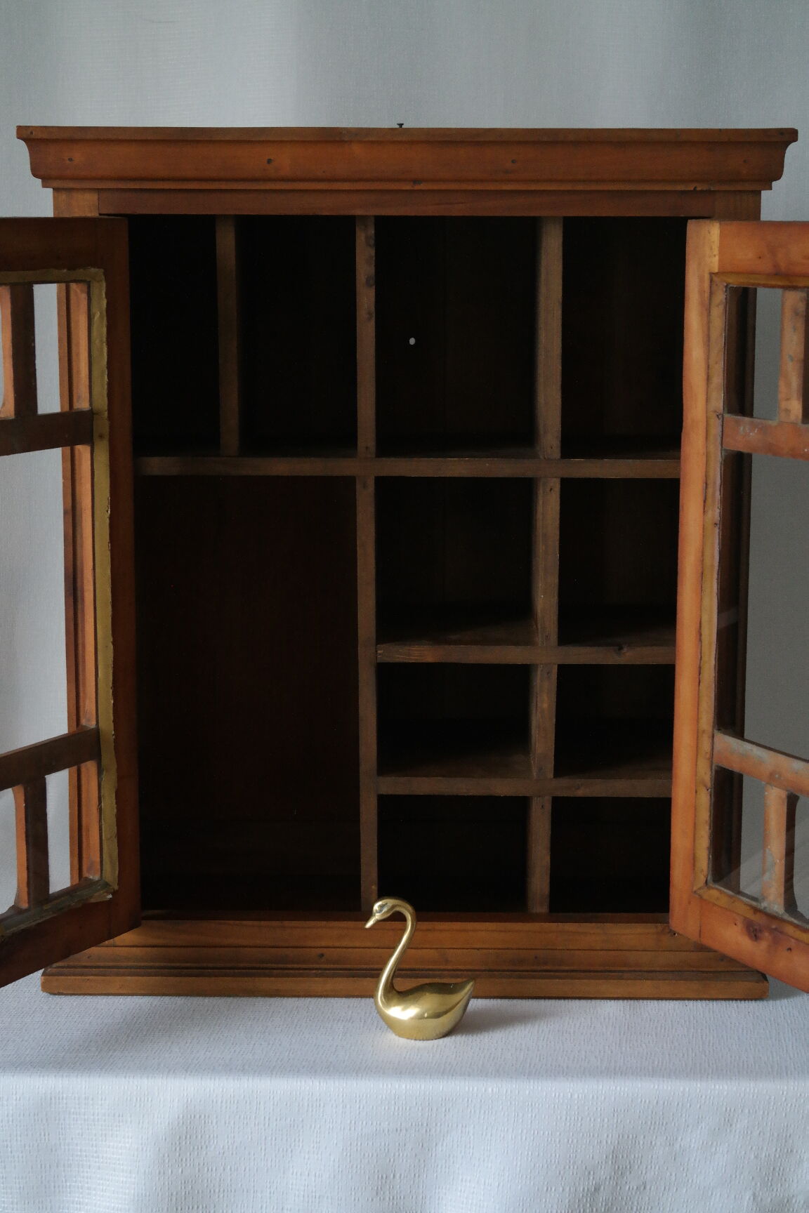 Antique walnut display cabinet from the 20th century.