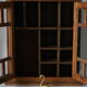 Antique walnut display cabinet from the 20th century.