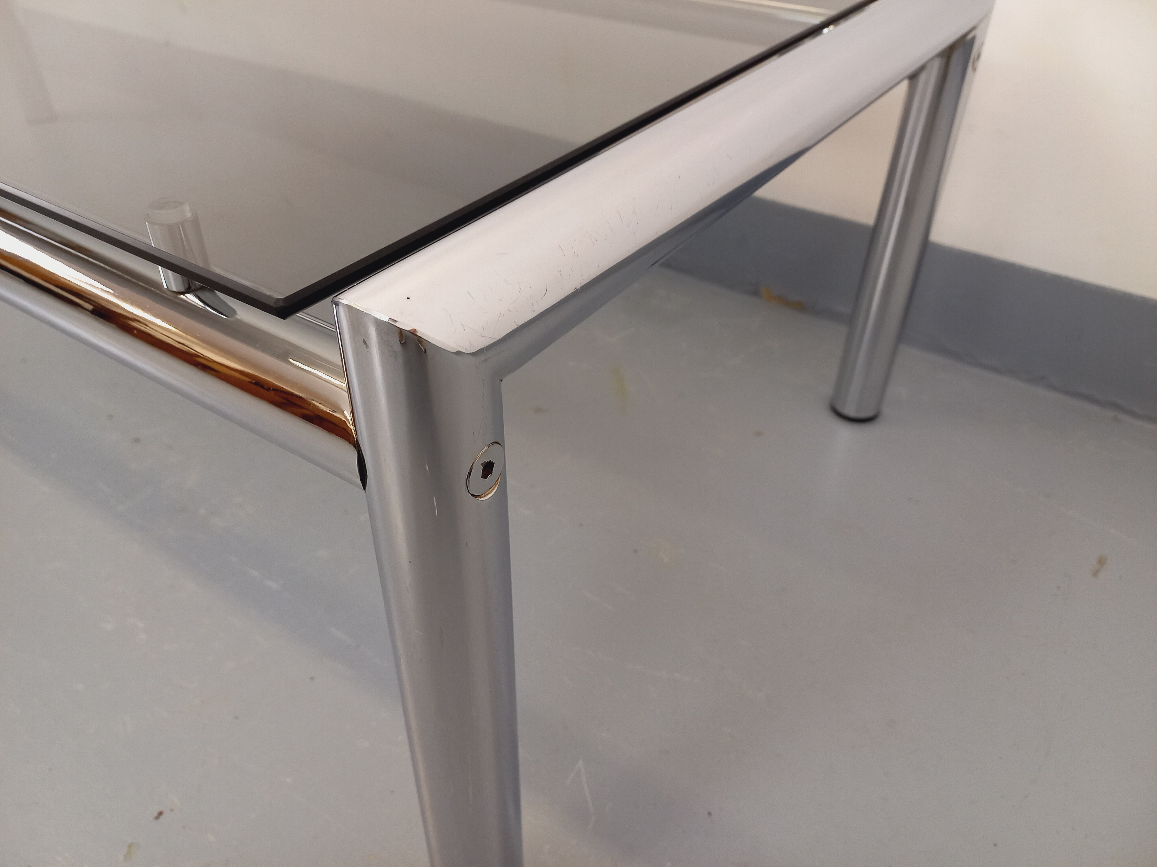 Vintage rectangular coffee table in smoked glass and chrome metal from the 1960s.