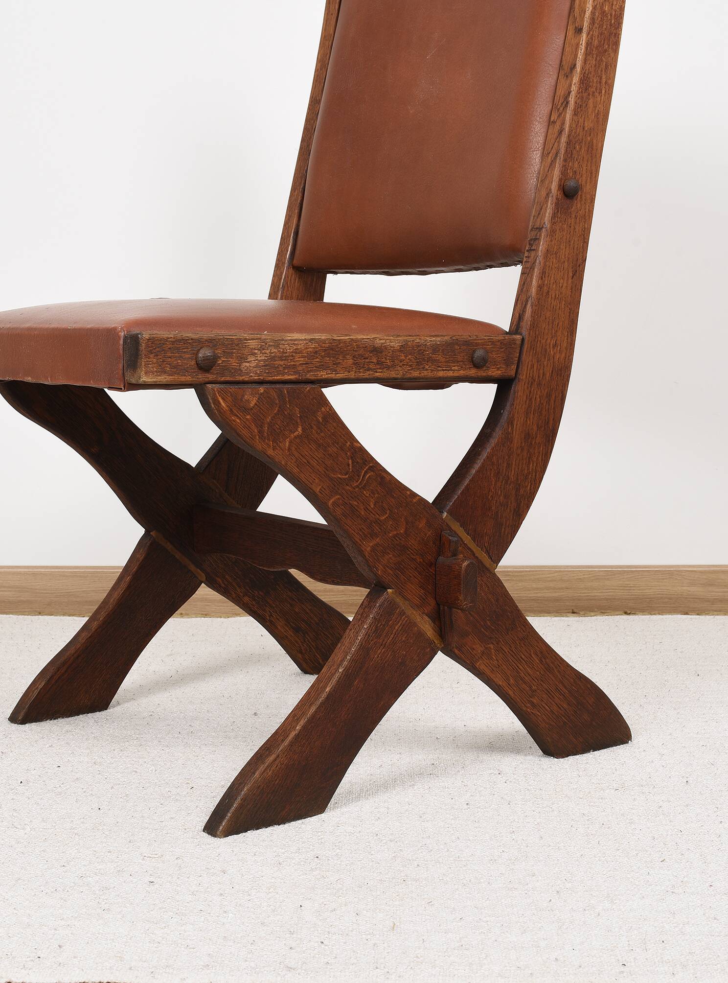 Pair of brutalist style chairs, in wood and leather.