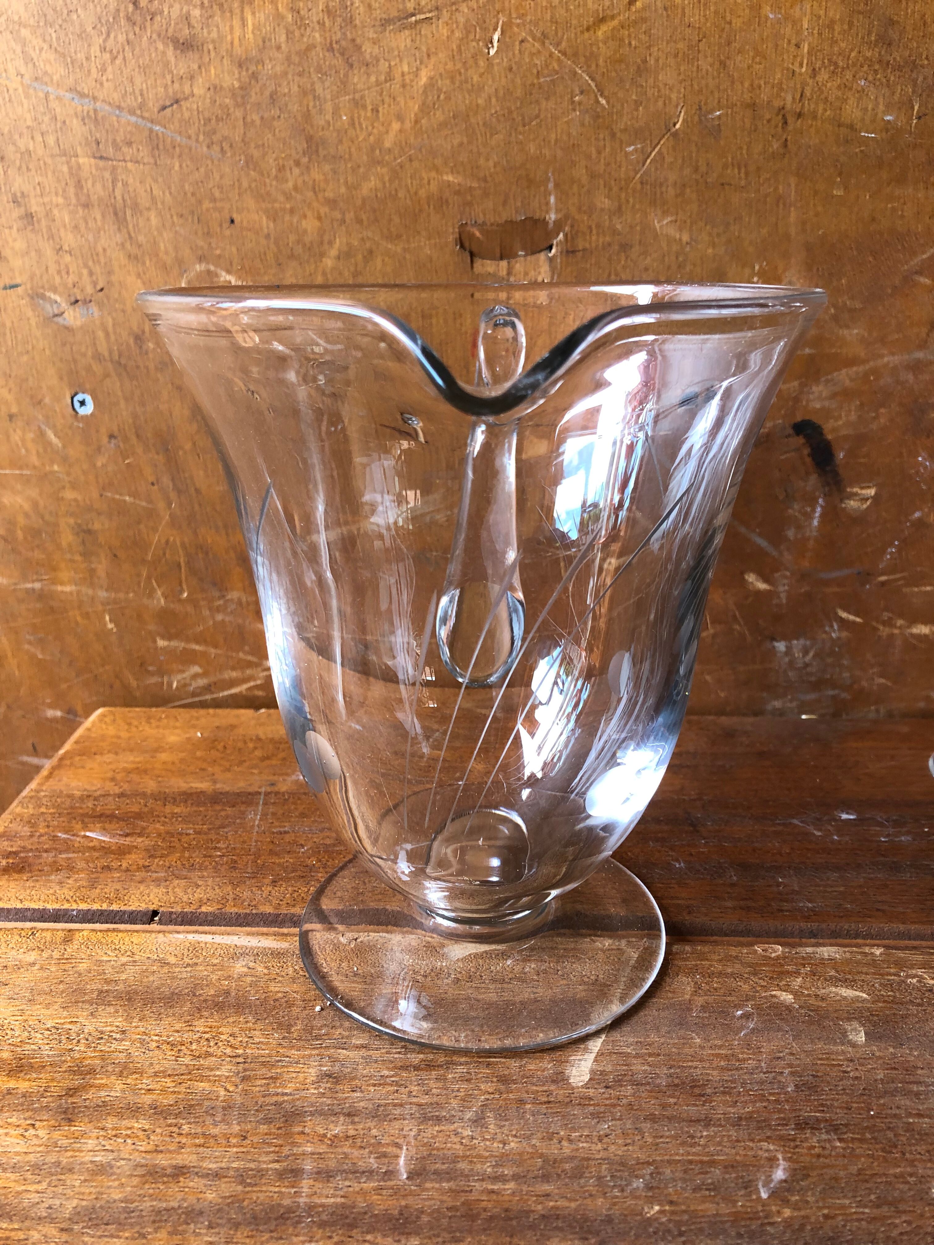 Old pitcher service and 5 foot glasses in engraved glass vintage table art